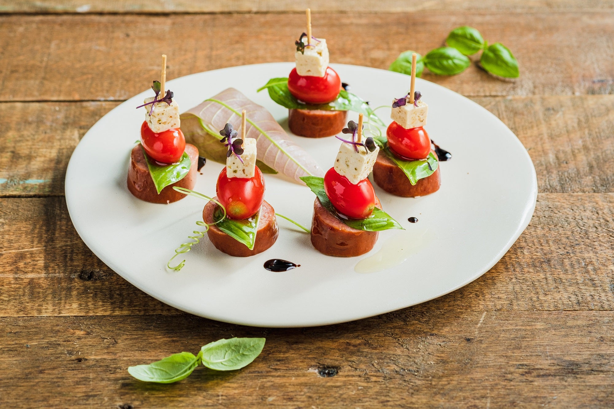 Canapé of Hungarian Sausage, Mozzarella, and Cherry Tomatoes