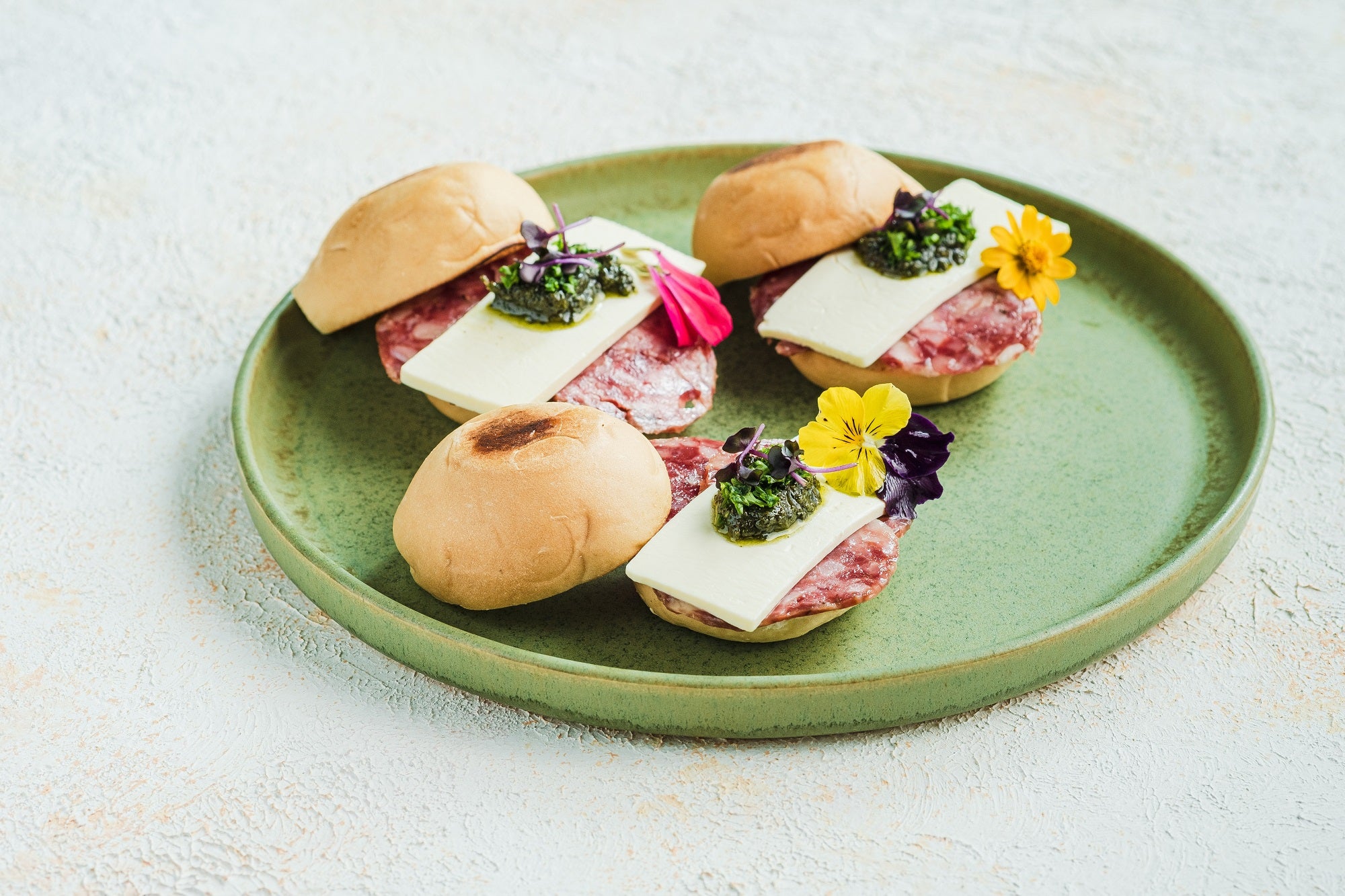 Pandesalitas with Salchichon Iberico, Kesong Puti, and Pesto